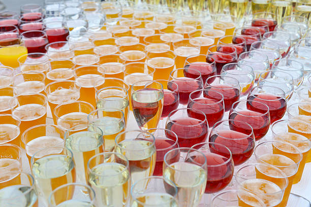 A lot of glasses with beer, red, white wine and juice, water, catering…