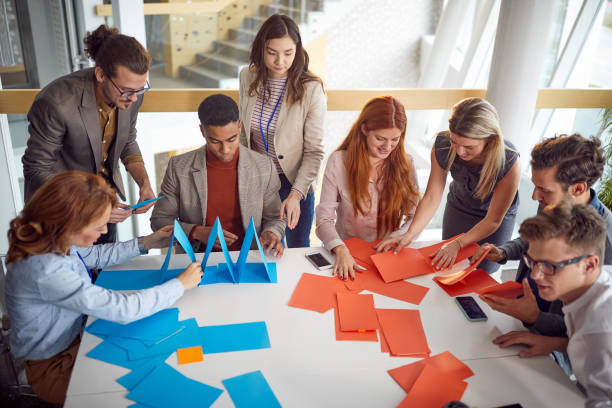 Group of multiethnic colleagues having fun in the office; Team building concept