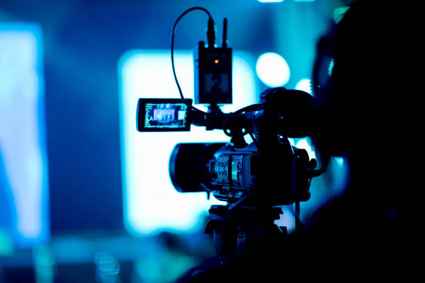 videographer close up, cameraman, man with camera, movie,”n
